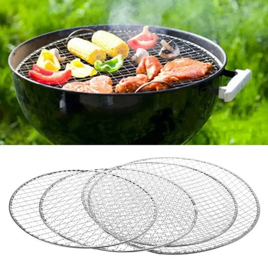 Round barbecue grill with food cooking on the grates.