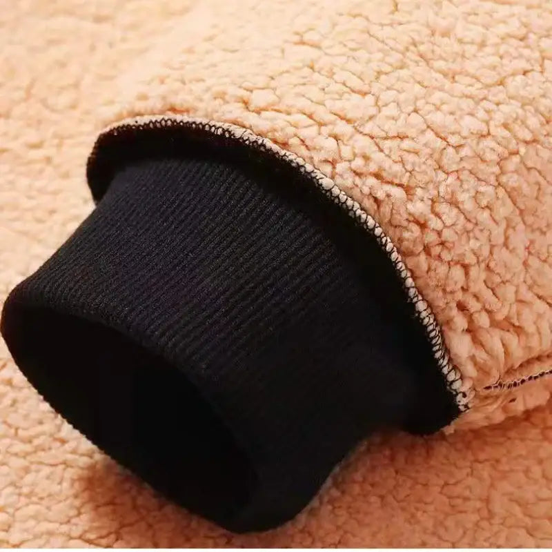 Fluffy peach-colored slipper with a black interior lining.