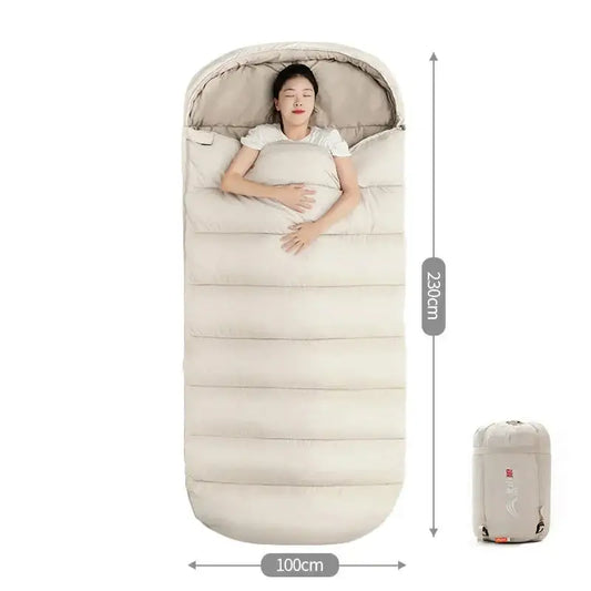 Sleeping bag with an integrated pillow and a person lying inside it.