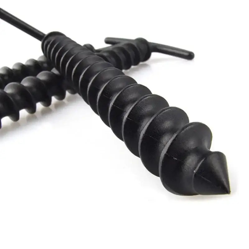 Black spiral-shaped sex toy with a tapered tip and ribbed texture.