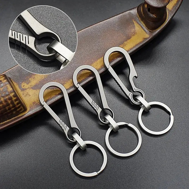 Stainless steel keychain hooks with detachable rings.