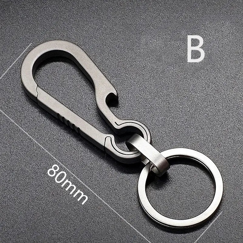 Metallic carabiner-style keychain with an attached ring.