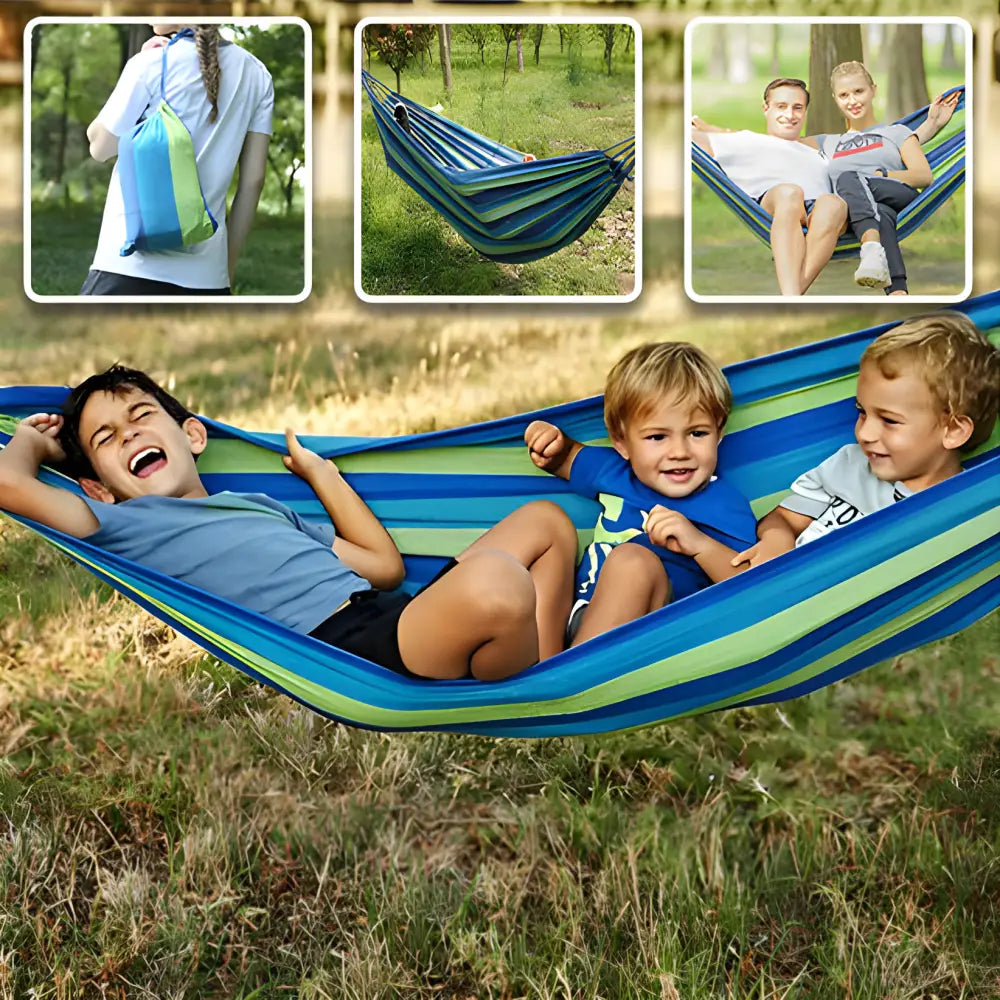 Striped fabric hammock suspended between trees.