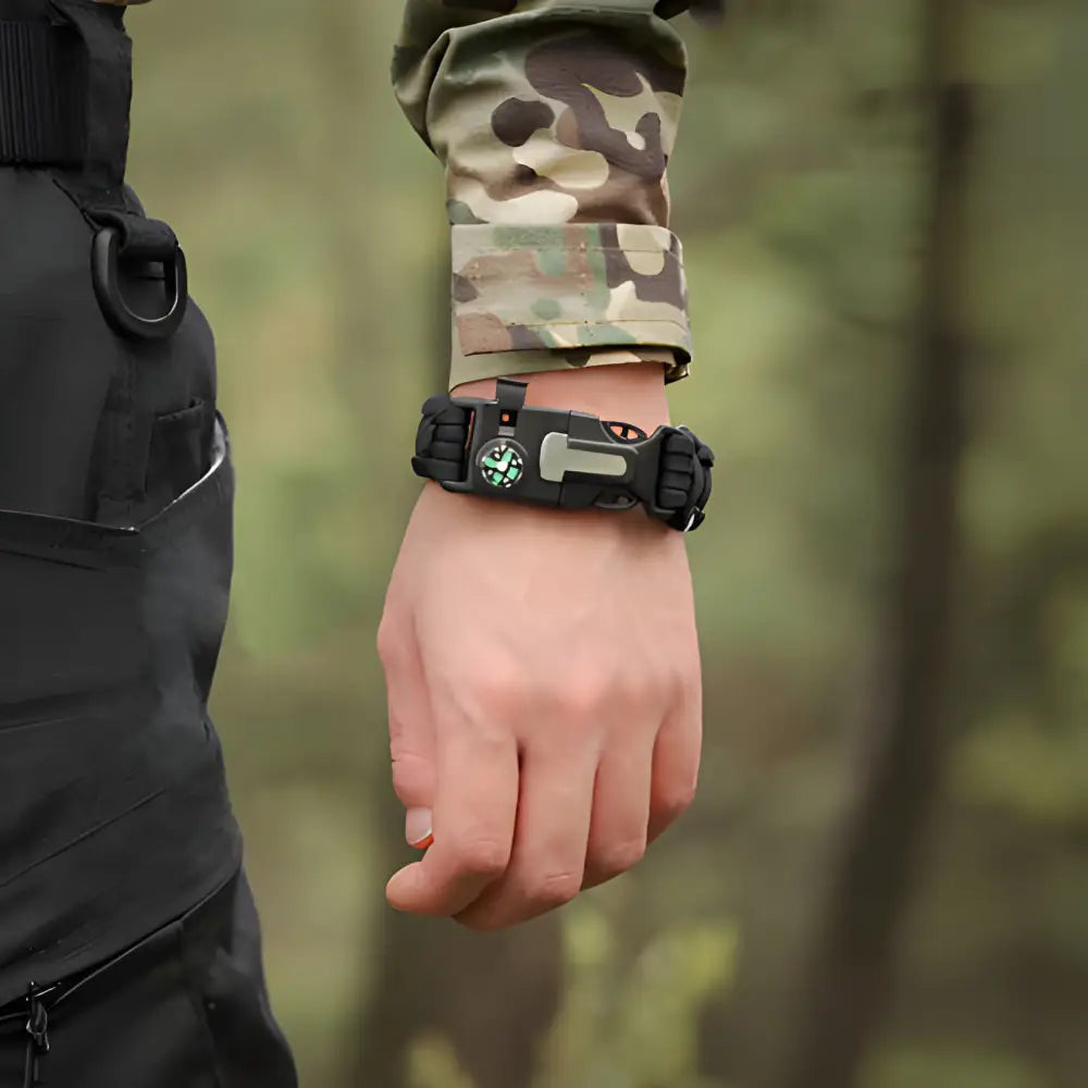 Tactical wristwatch worn on a camouflage-sleeved arm.