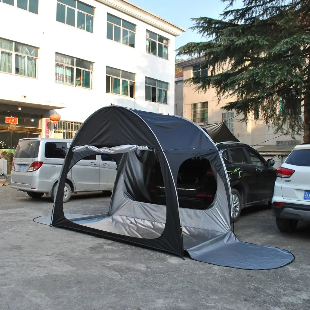 Portable pop-up tent designed to fit over a car.