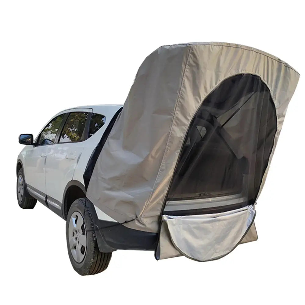 Tent-like attachment connected to the rear of an SUV, providing covered space behind the vehicle.