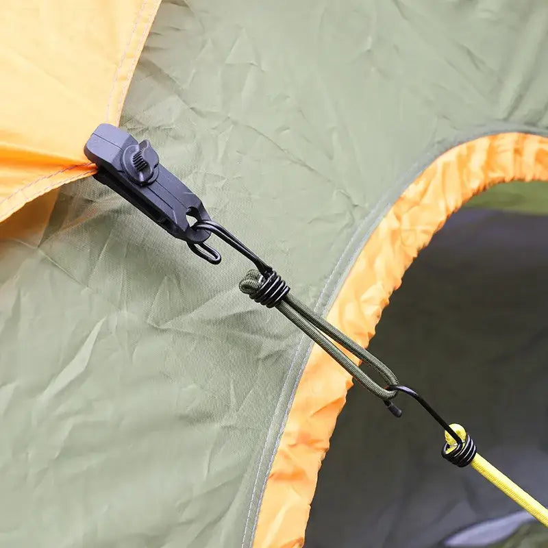 Tent pole connector attaching to a fabric section of a tent.