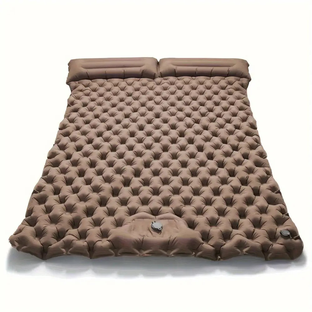 Inflatable camping mattress with a textured, dimpled surface.