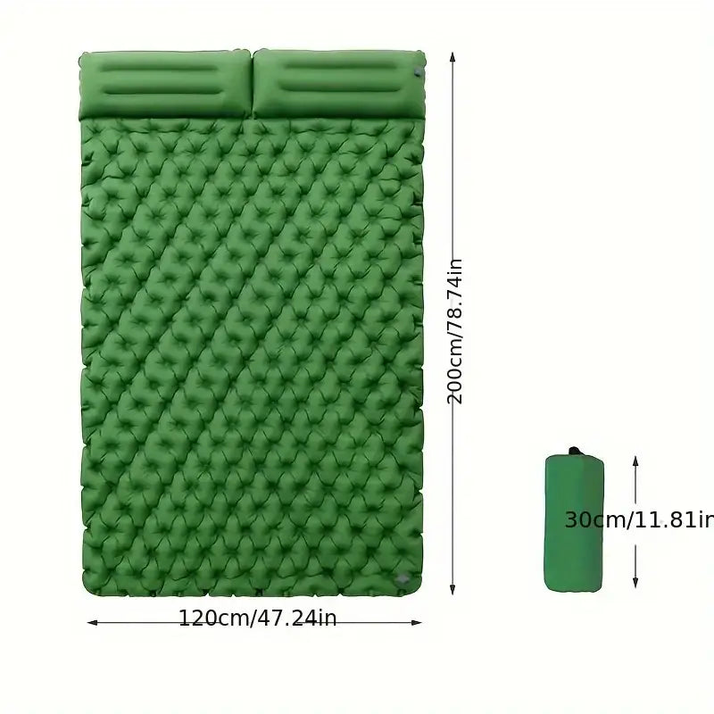 Green inflatable camping sleeping pad with attached pillow section.