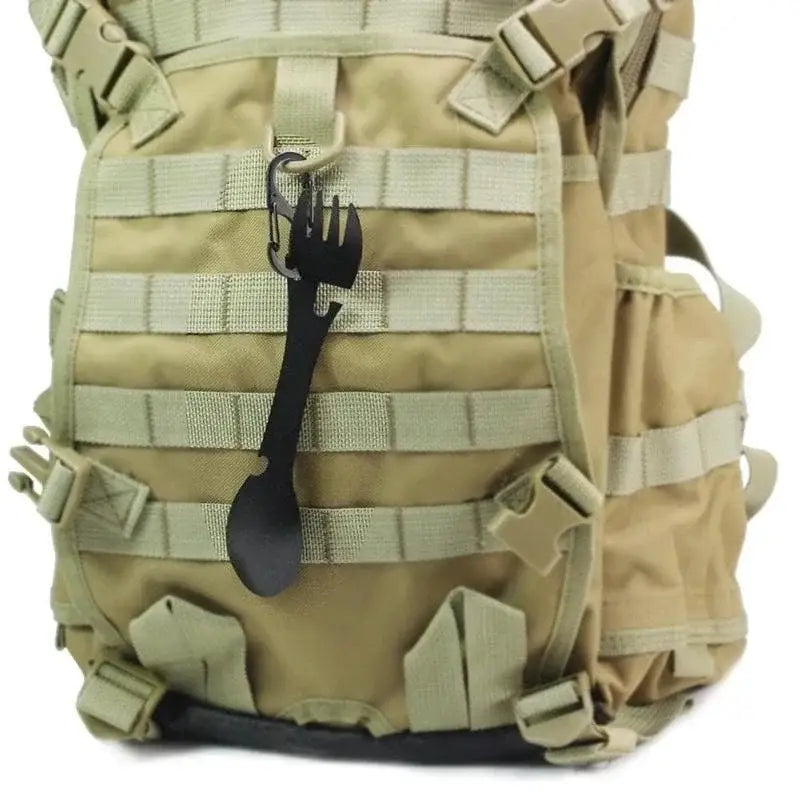 Tactical military-style backpack with MOLLE webbing and multiple attachment points.