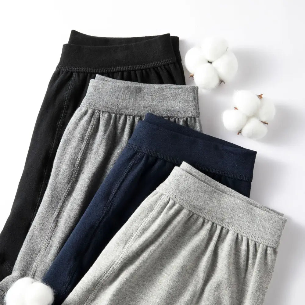 Assortment of leggings or yoga pants in black, gray, and navy colors.