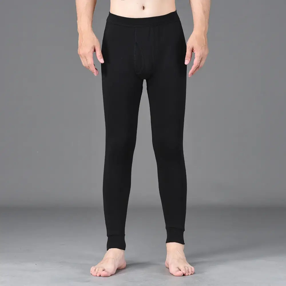 Black fitted leggings or thermal underwear worn by a person.