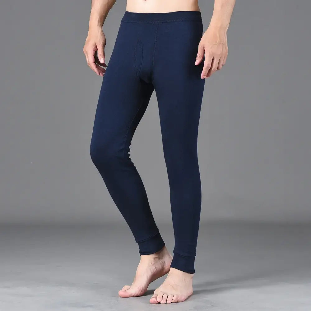 Navy blue thermal leggings or long underwear bottoms worn by a person.