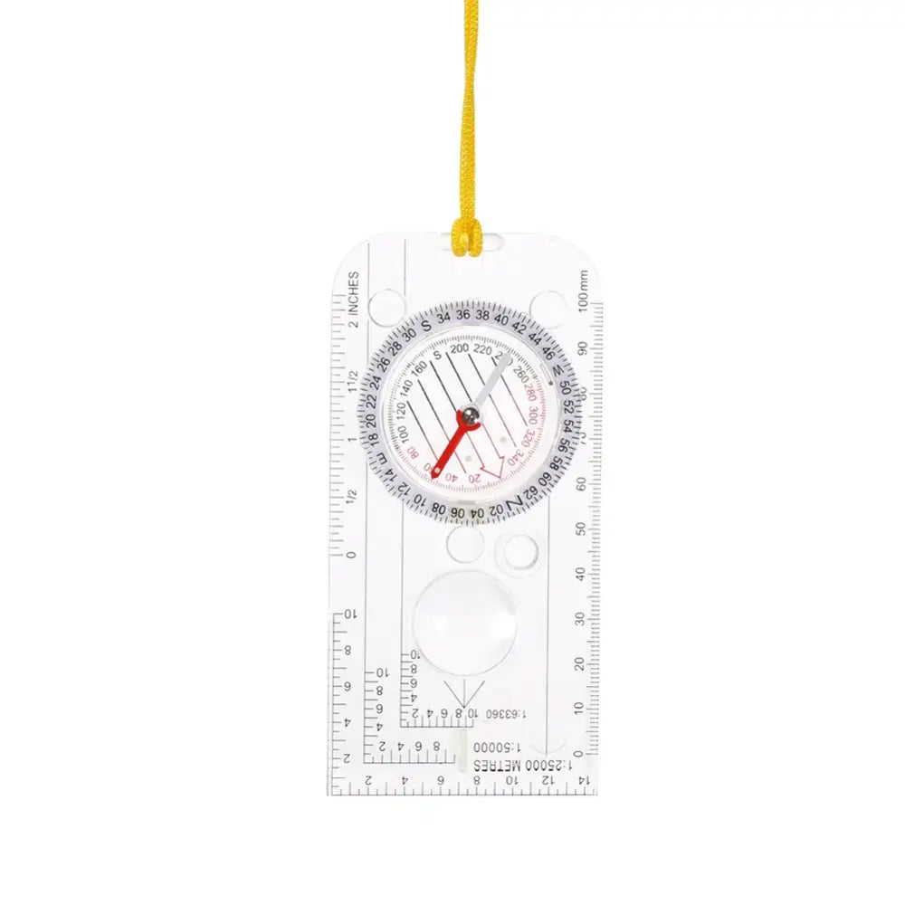 Transparent plastic compass with ruler markings and a yellow lanyard attached.