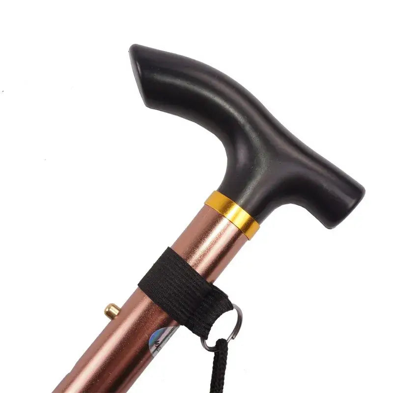 Walking cane with a curved black handle and copper-colored shaft.