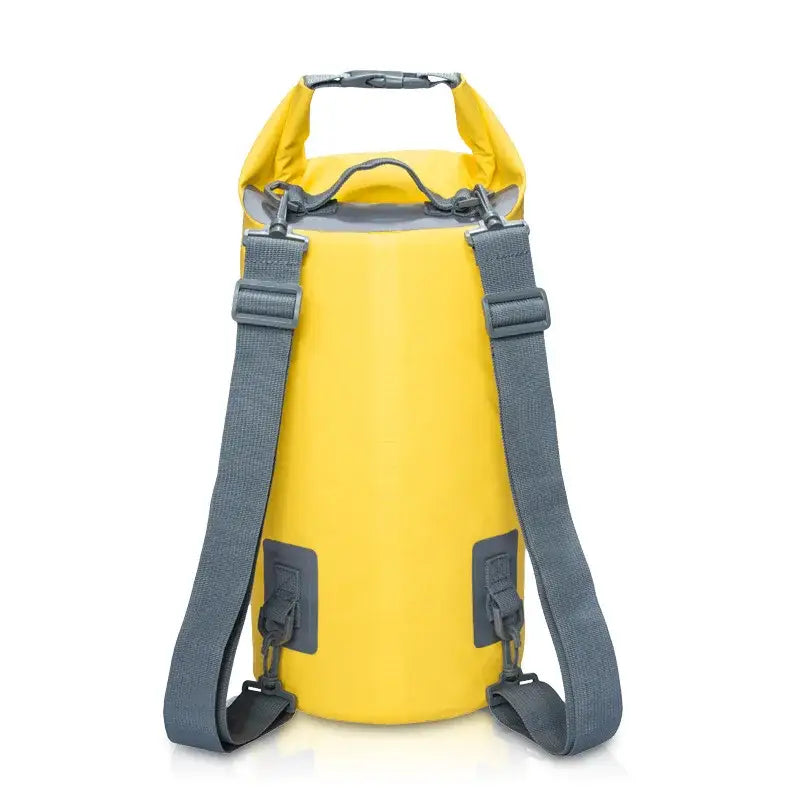 Yellow waterproof dry bag with gray shoulder straps.