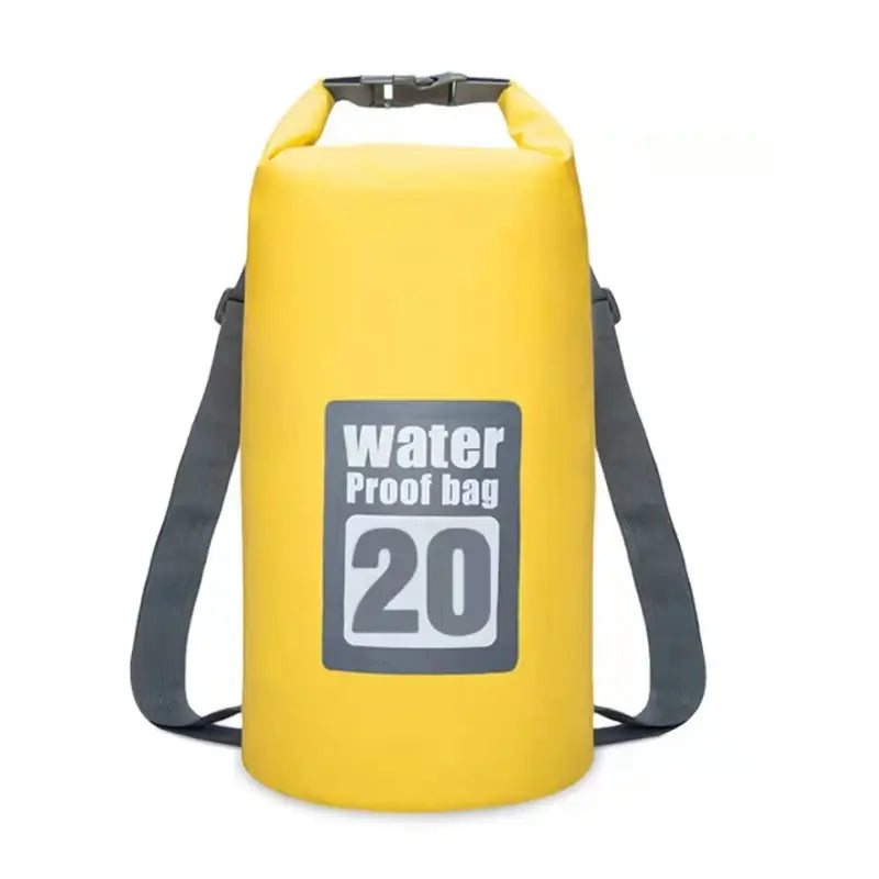 Yellow waterproof dry bag with a capacity of 20 liters and shoulder straps.