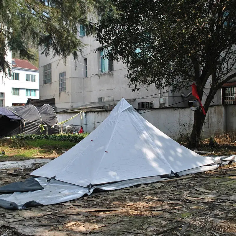 White pyramid-shaped tent or shelter.