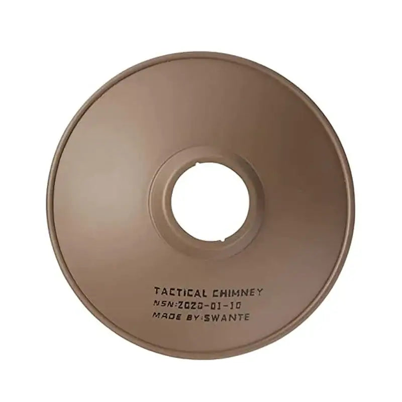 Circular tan-colored disc with a hole in the center, labeled ’TACTICAL CHIMNEY’ on its surface.