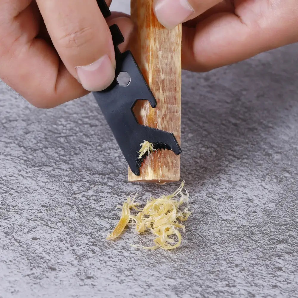 Wood planer or scraper tool shaving thin curls from a wooden surface.