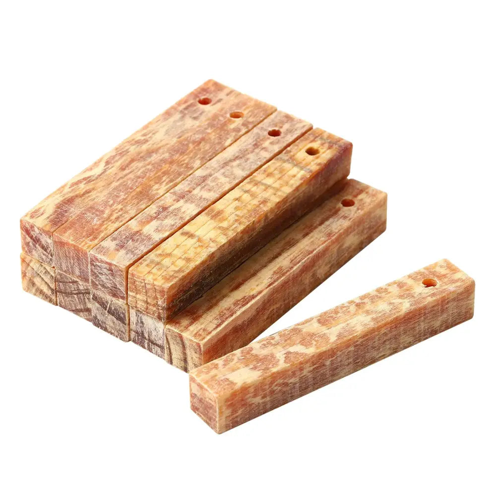 Wooden blocks or planks with holes, stacked together.