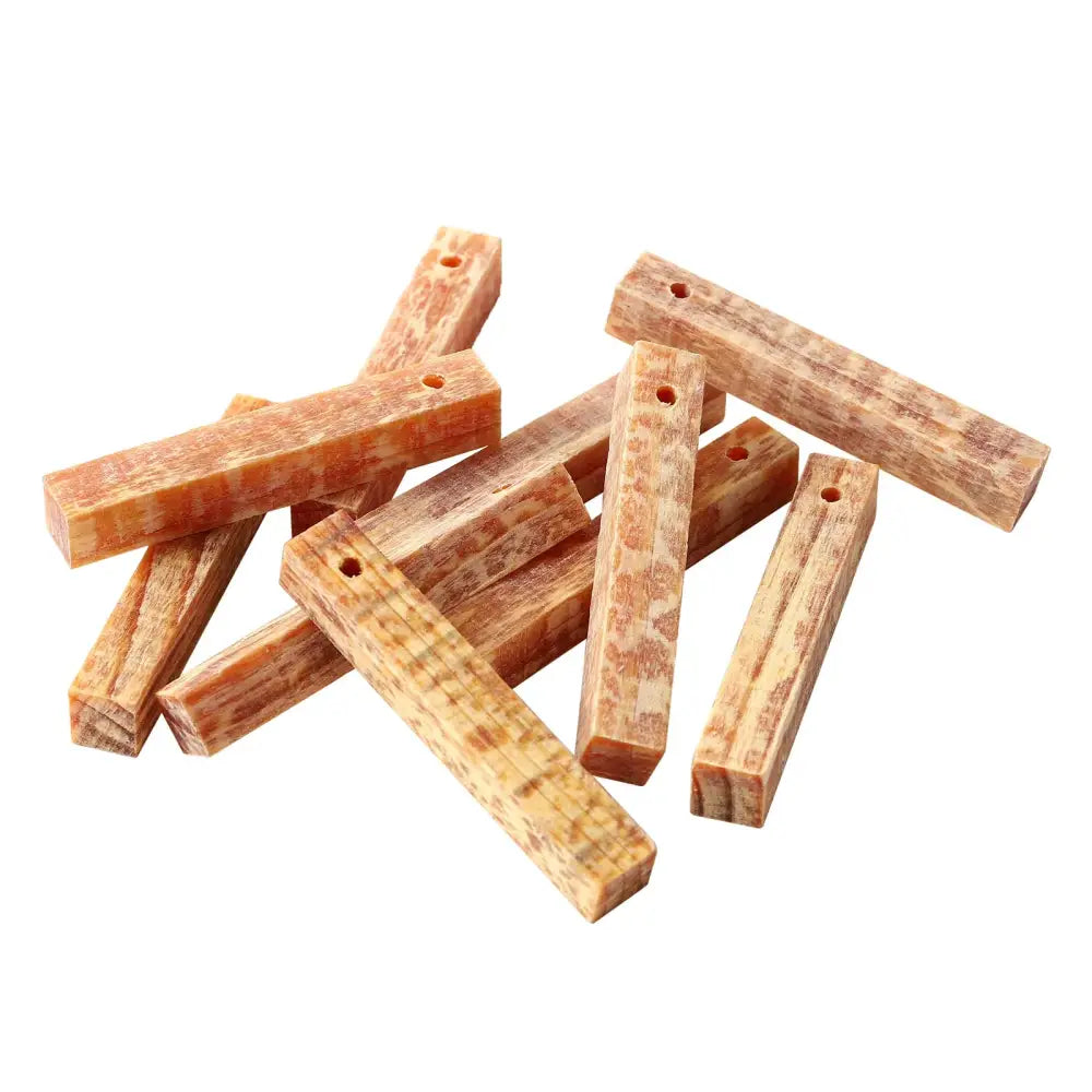 Wooden pegs or dowels with holes drilled through them.