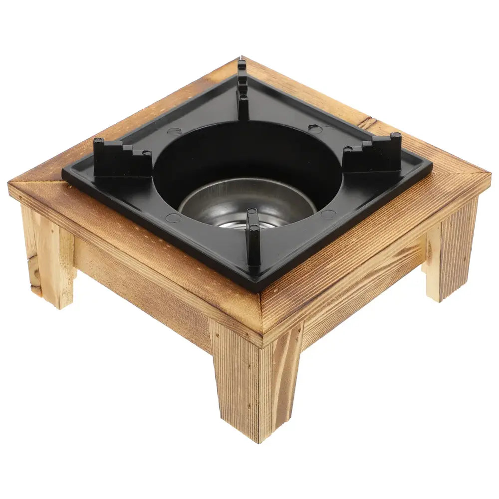 Single-burner tabletop stove with a wooden base and black metal cooking surface.