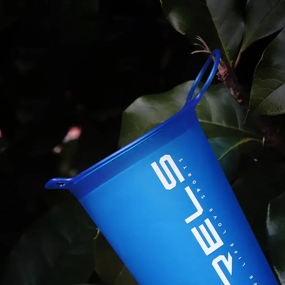 Bright blue reusable water bottle with white lettering.