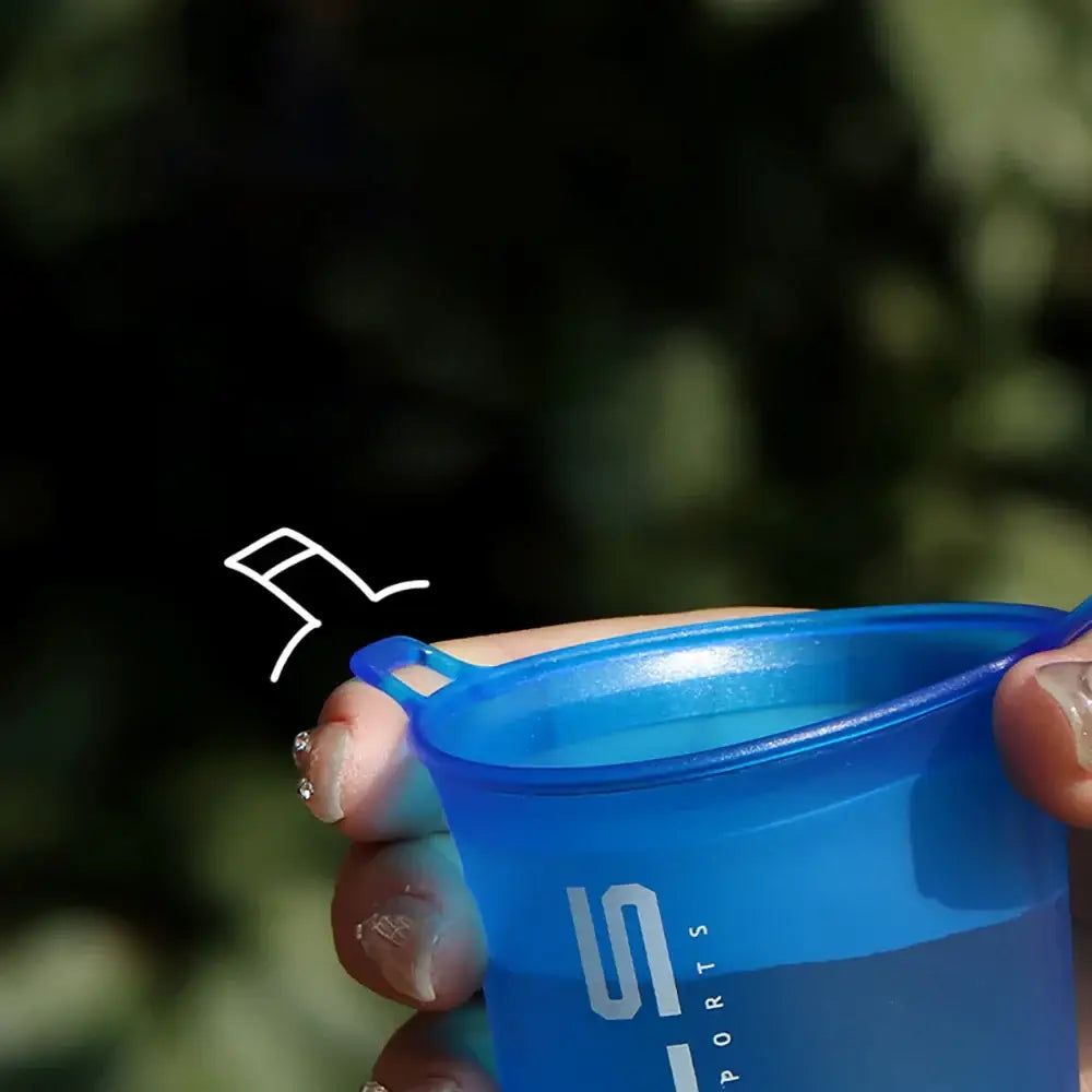 Blue plastic measuring cup with volume markings.